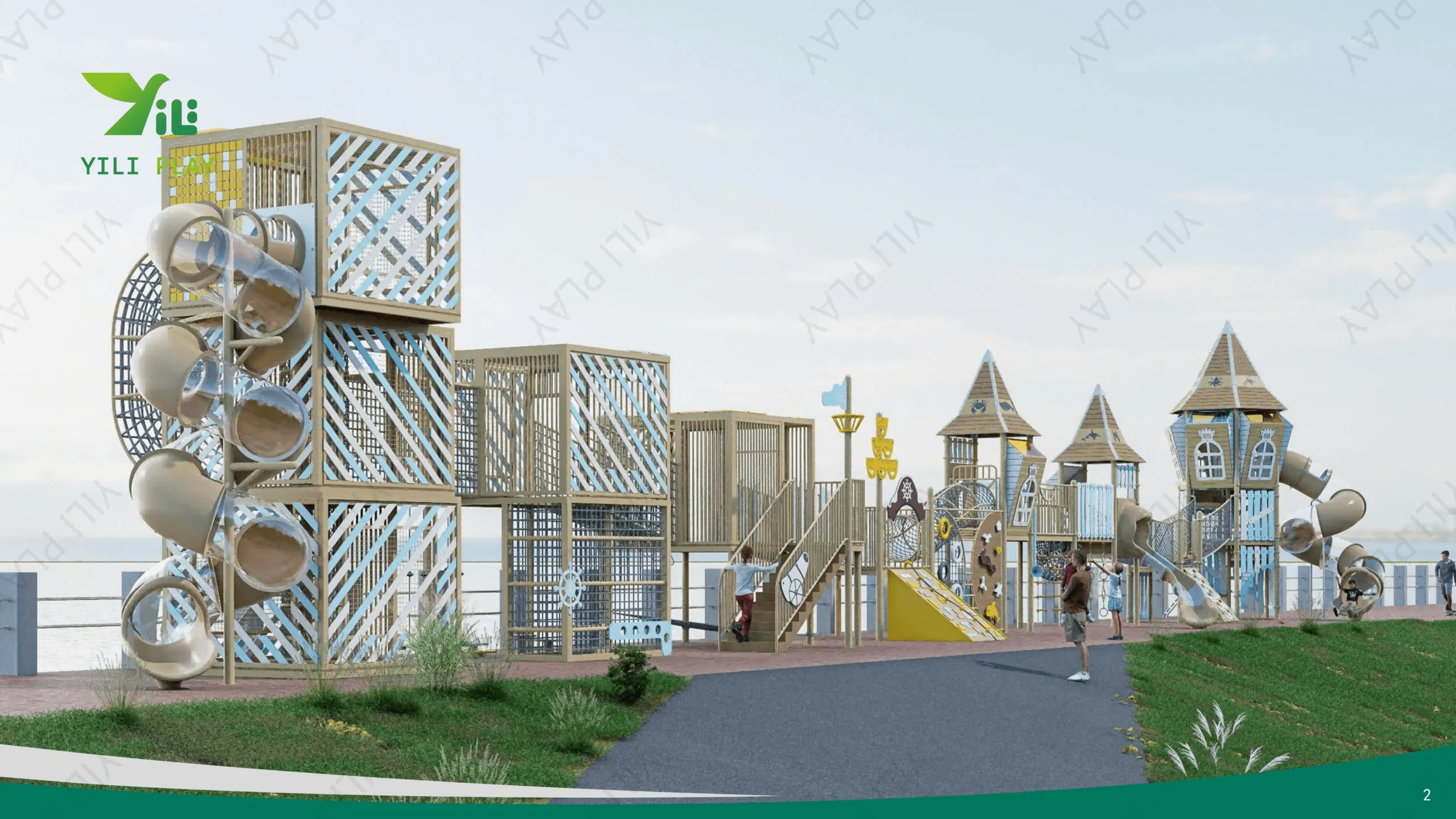 Seaside outdoor playground equipment with castle towers, climbing nets, and spiral tube slides in a cultural tourism park