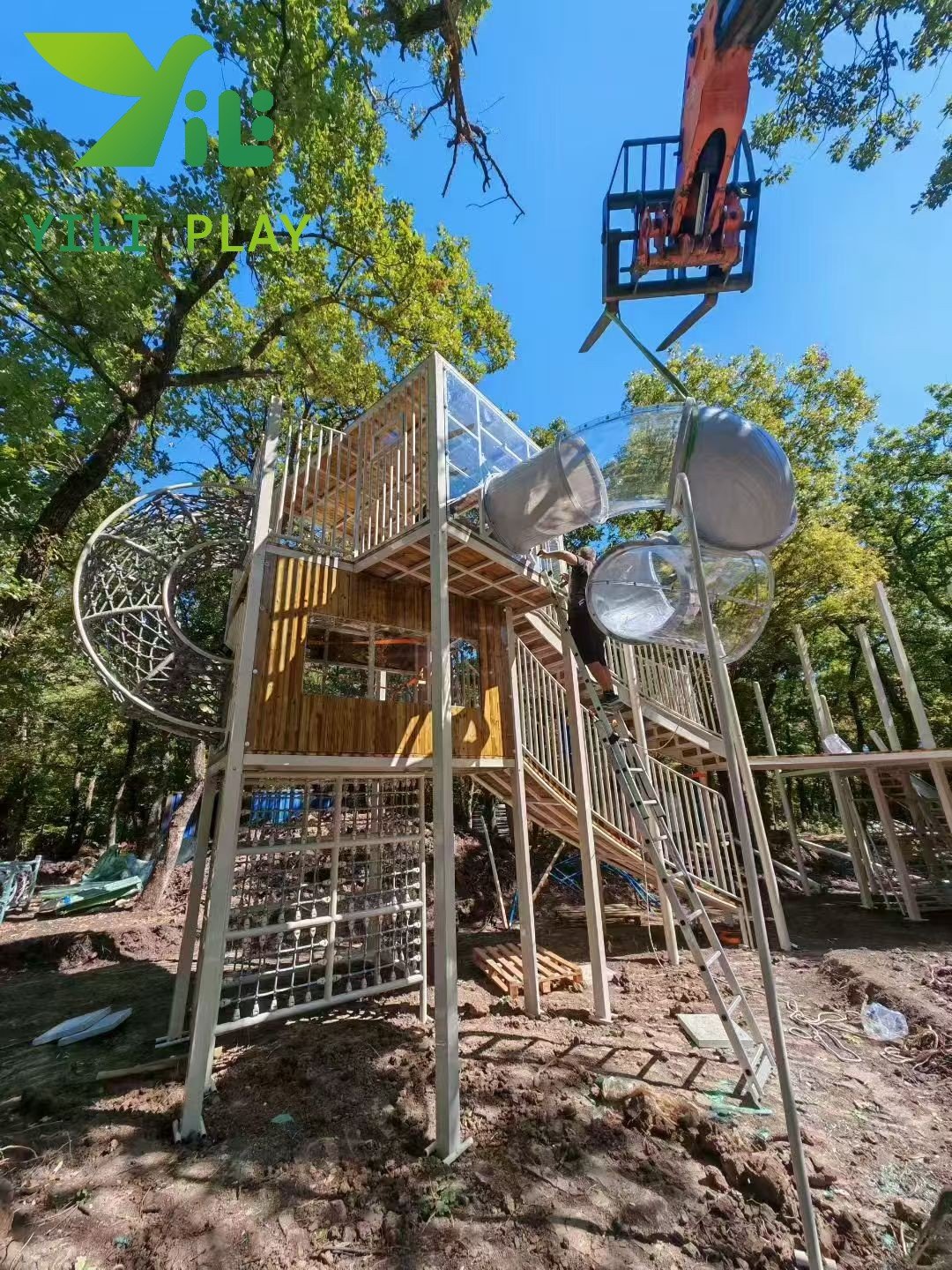 European pinecone outdoor playground with natural wooden cabins, rope bridges, and climbing structures