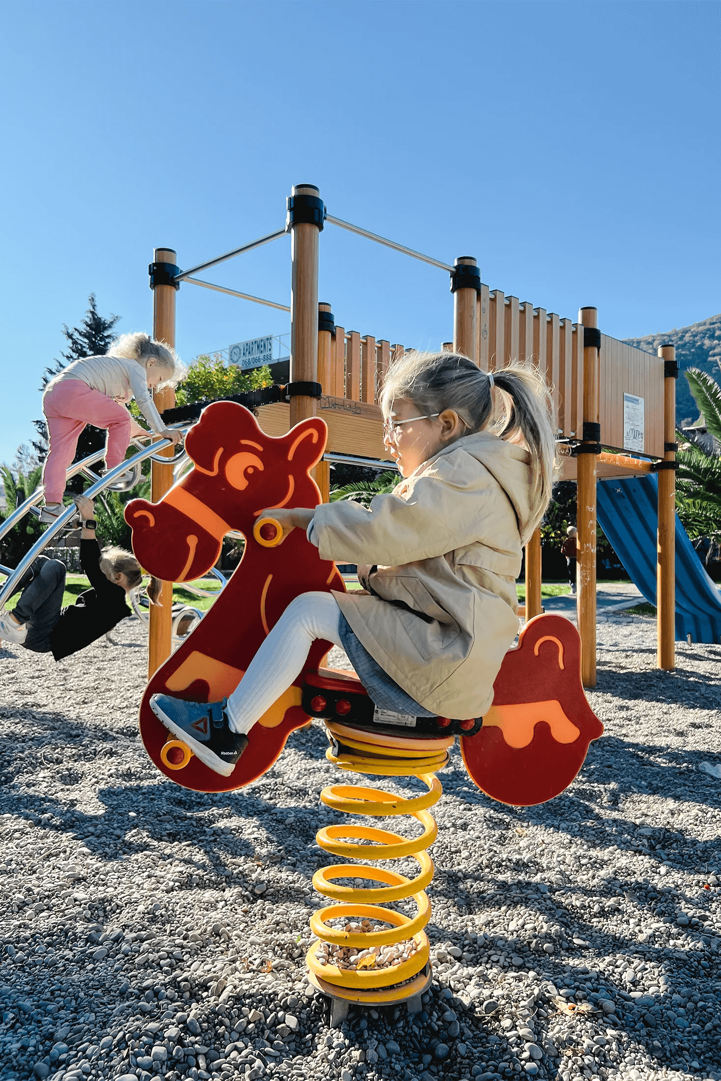 a girl ride an rocking horse