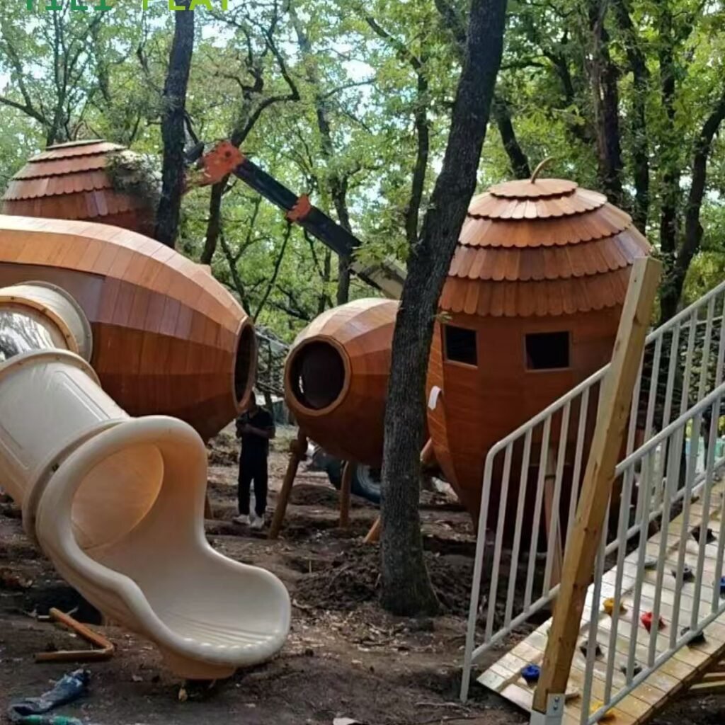 European pinecone outdoor playground with natural wooden cabins, rope bridges, and climbing structures
